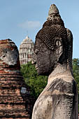 Ayutthaya, Thailand. Wat Mahathat, Buddha statue of the gallery enclosing the collapsed central prang.